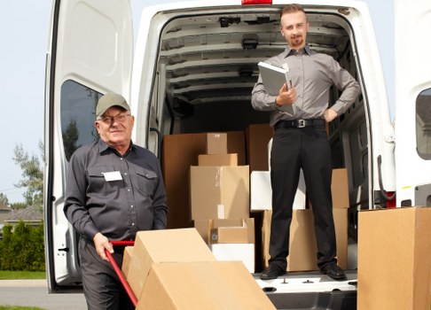 Removal team planning a move in South Kensington with boxes and furniture