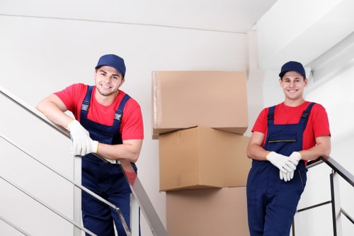 Packed moving boxes and furniture ready for removal services in South Kensington
