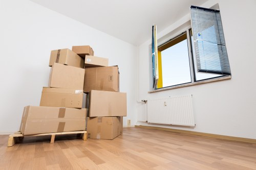 Office equipment and packed boxes prepared for commercial moves in South Kensington