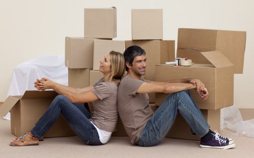 Moving team handling boxes and desks in a South Kensington commercial property