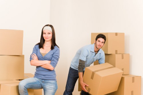 Professional movers loading furniture into a van