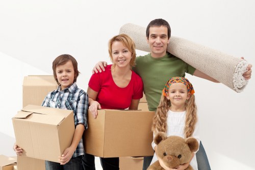 Loading heavy items into a van for relocation