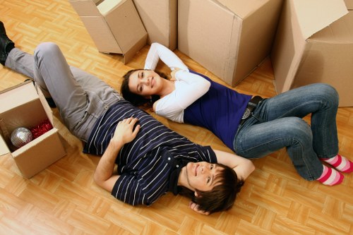 Packed boxes and wrapped furniture ready for removal