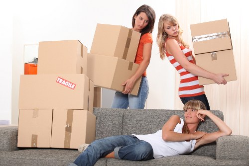 Team handling packed office equipment during a local move