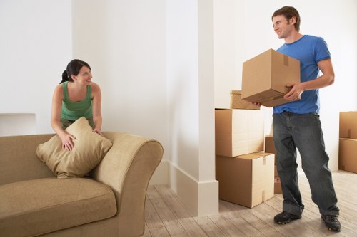 Professional movers loading furniture for a same day move in South Kensington